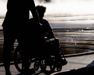man in wheelchair from work injury